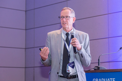 Professor Edward Stuenkel, founding dean of the College of the Health and Life Sciences, speaking to the attendees.